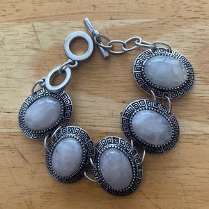Silver tone and light pink stoned bracelet. slightly adjustable